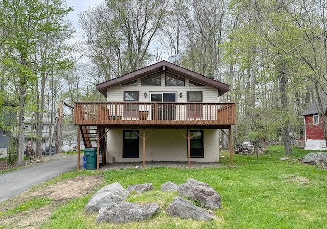 4751 Brentwood Dr, Tobyhanna, PA 18466 - rear view of property featuring a wooden deck, stairs, and a yard
