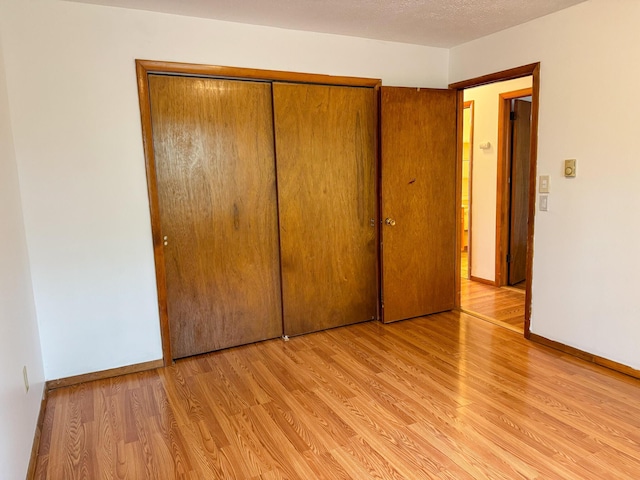 4751 Brentwood Dr, Tobyhanna, PA 18466 - unfurnished bedroom featuring light wood-type flooring, a closet, and baseboards