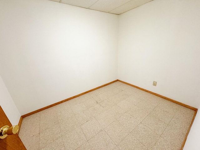 4751 Brentwood Dr, Tobyhanna, PA 18466 - empty room featuring a drop ceiling, baseboards, and light flooring