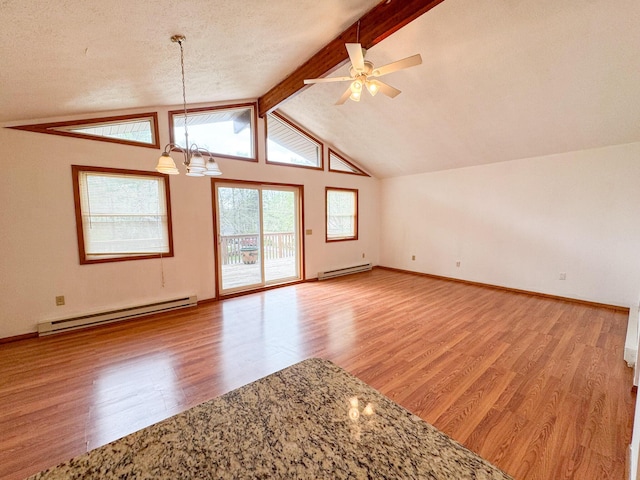4751 Brentwood Dr, Tobyhanna, PA 18466 - spare room featuring baseboard heating, a chandelier, wood finished floors, and a ceiling fan