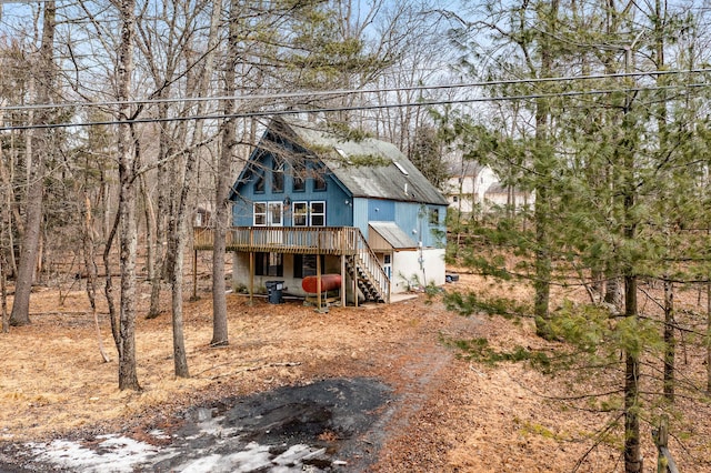 view of front of property featuring a deck and stairway