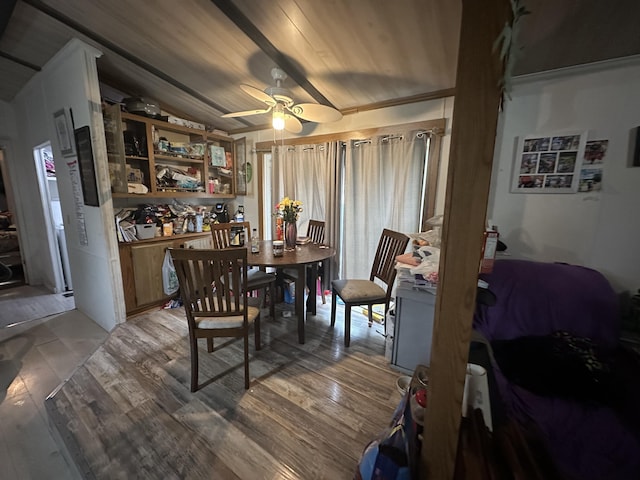 dining room with ceiling fan and light wood finished floors