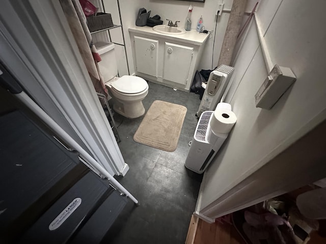 bathroom with vanity and toilet