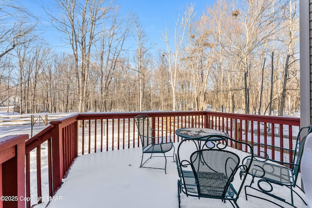 view of snow covered deck