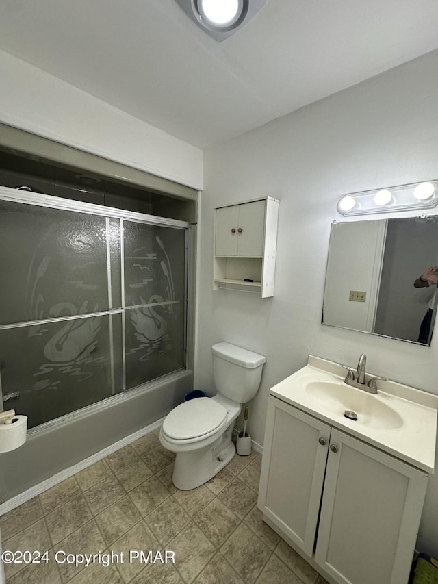 full bath featuring combined bath / shower with glass door, vanity, and toilet