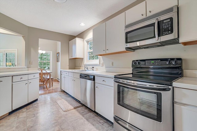 2181 Oak Hill Dr, Buck Hill Falls, PA 18323 - kitchen with a sink, light countertops, plenty of natural light, and stainless steel appliances