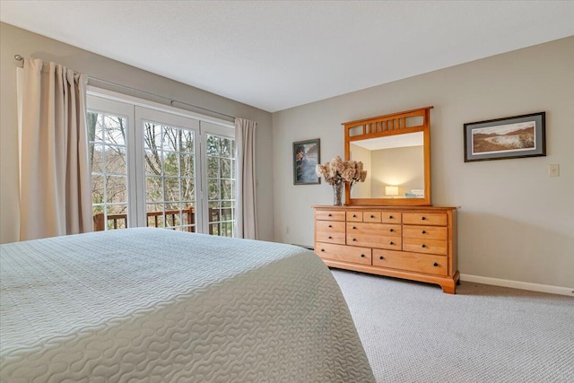 2181 Oak Hill Dr, Buck Hill Falls, PA 18323 - bedroom with carpet flooring, access to outside, and baseboards