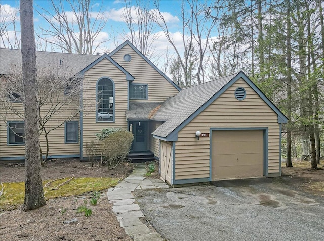 2181 Oak Hill Dr, Buck Hill Falls, PA 18323 - view of front of home with a garage, driveway, and roof with shingles