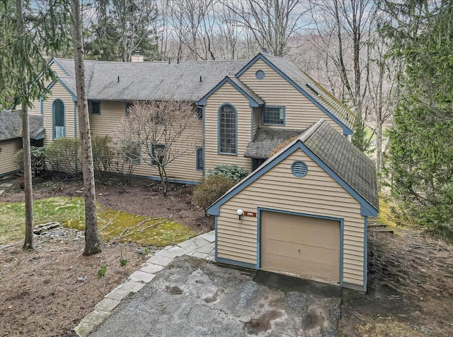 2181 Oak Hill Dr, Buck Hill Falls, PA 18323 - view of front of home featuring a garage and aphalt driveway