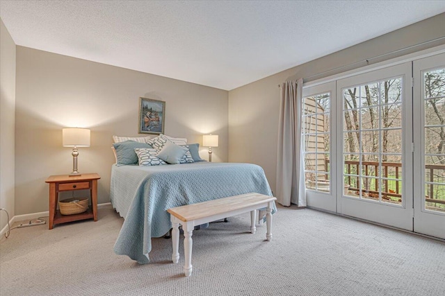 2181 Oak Hill Dr, Buck Hill Falls, PA 18323 - bedroom with carpet floors, access to exterior, multiple windows, and baseboards