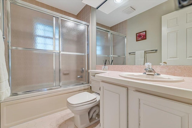 2181 Oak Hill Dr, Buck Hill Falls, PA 18323 - full bathroom with visible vents, toilet, enclosed tub / shower combo, vanity, and tile patterned flooring