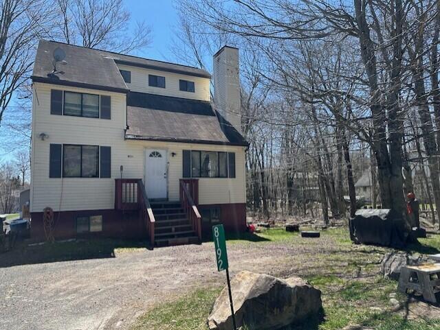 8192 Elk Ct, Tobyhanna, PA 18466 - view of front facade featuring a chimney