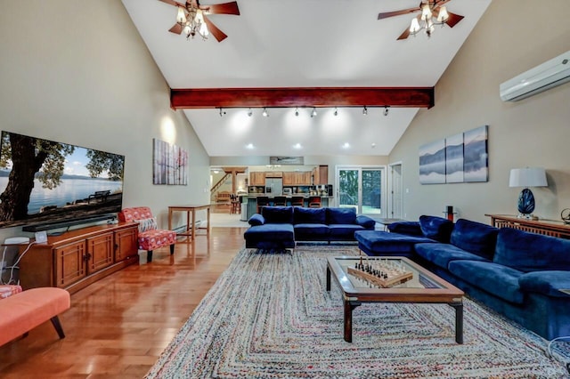 living room with beamed ceiling, light wood-style floors, an AC wall unit, and a ceiling fan