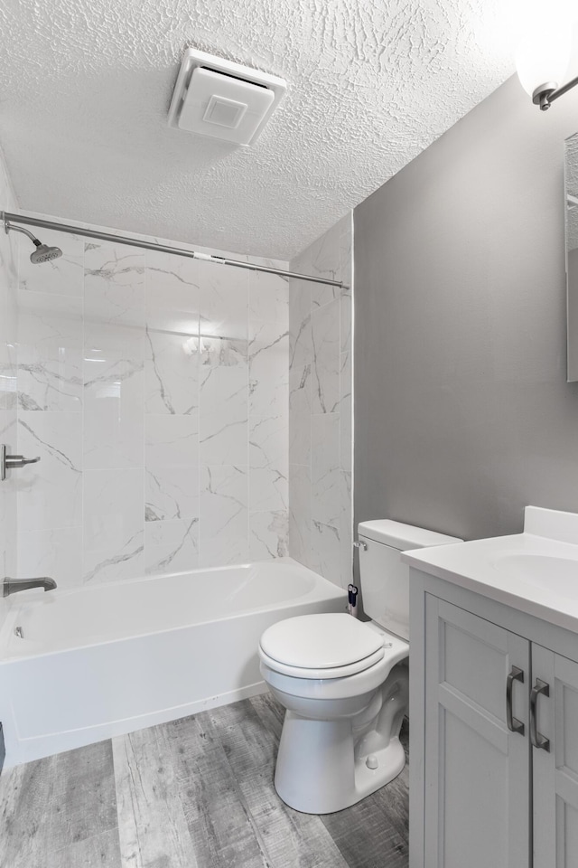 115 Tumbleweed Dr, Long Pond, PA 18334 - full bathroom featuring vanity, shower / washtub combination, a textured ceiling, and wood finished floors