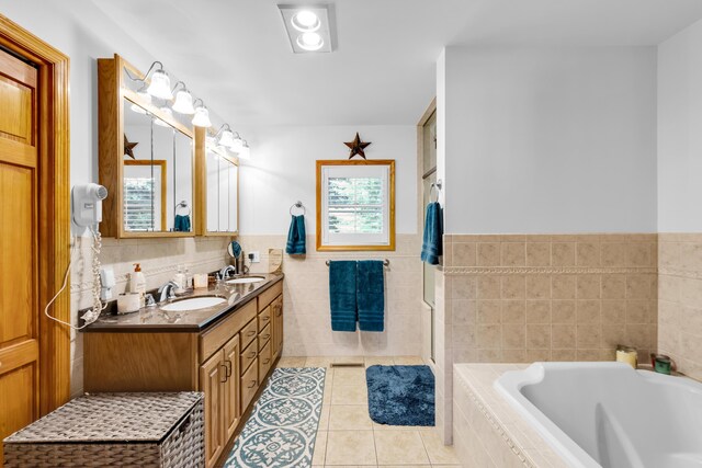 5194 S Hamilton S, Saylorsburg, PA 18353 - bathroom featuring tile walls, tile patterned floors, a bath, double vanity, and wainscoting