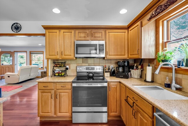 5194 S Hamilton S, Saylorsburg, PA 18353 - kitchen with appliances with stainless steel finishes, backsplash, recessed lighting, dark wood-style floors, and light stone counters