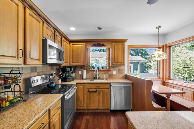 5194 S Hamilton S, Saylorsburg, PA 18353 - kitchen with appliances with stainless steel finishes, dark wood finished floors, light stone countertops, tasteful backsplash, and recessed lighting