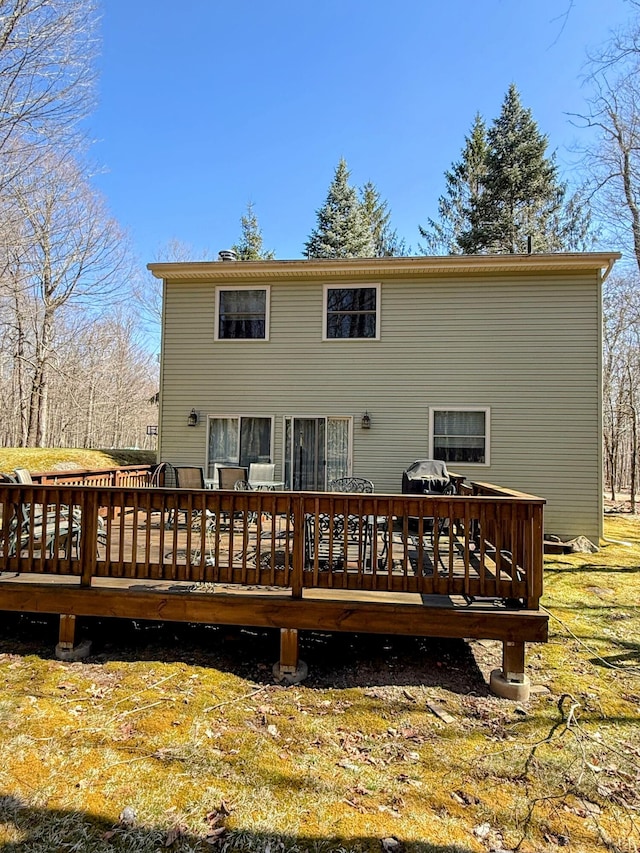rear view of house featuring a deck