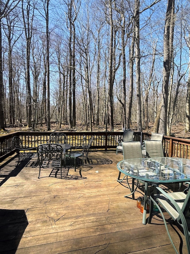 wooden terrace featuring outdoor dining space