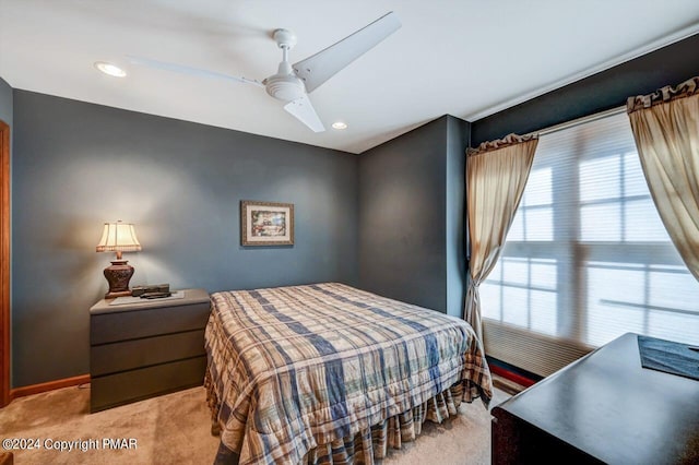 bedroom featuring ceiling fan, recessed lighting, light colored carpet, and baseboards