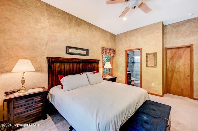 bedroom with ceiling fan, baseboards, carpet flooring, and ensuite bathroom