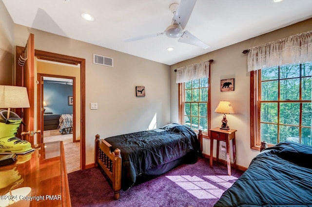 carpeted bedroom with ceiling fan, recessed lighting, visible vents, and baseboards