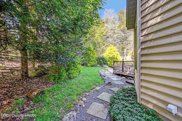 view of yard featuring a wooden deck