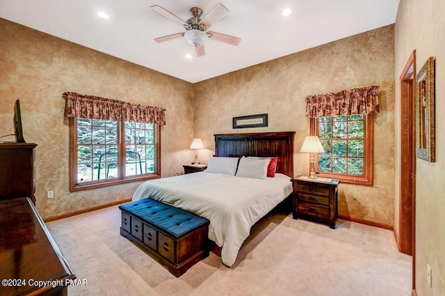 carpeted bedroom with ceiling fan, baseboards, and recessed lighting