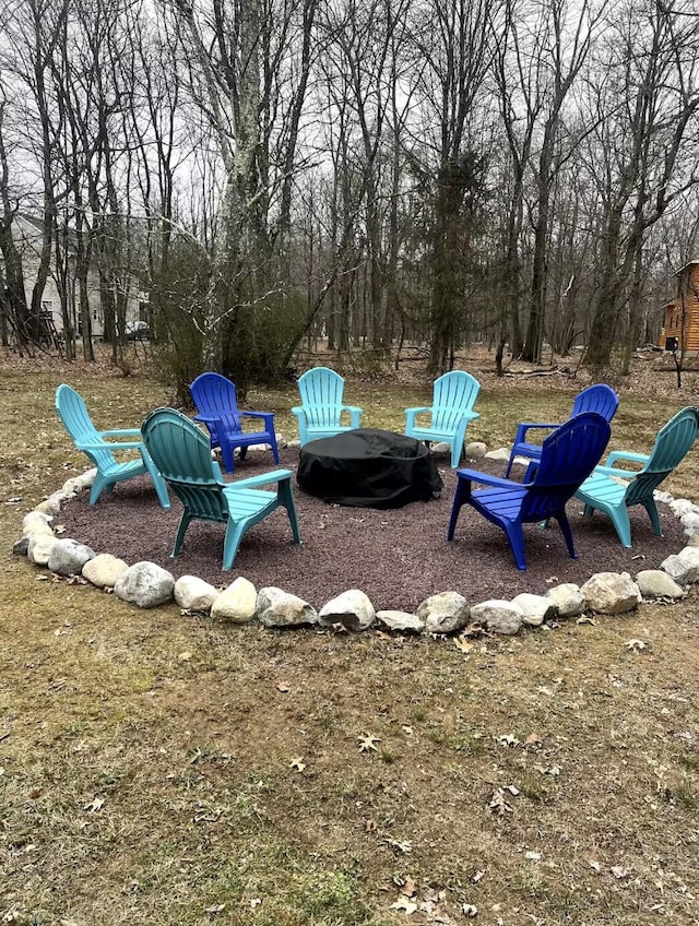 view of yard with an outdoor fire pit