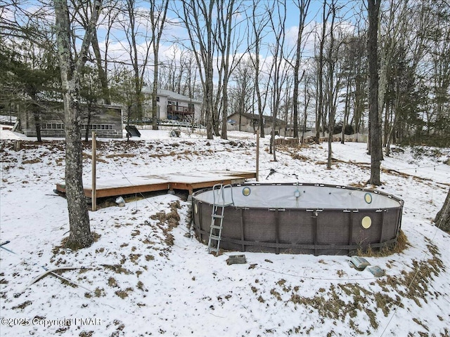 115 Aspen Cir E, Stroudsburg, PA 18302 - yard covered in snow with an outdoor pool