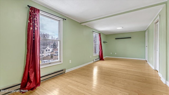 115 Aspen Cir E, Stroudsburg, PA 18302 - spare room featuring a baseboard radiator, healthy amount of natural light, a baseboard heating unit, wood finished floors, and ornamental molding