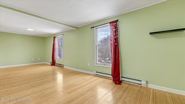115 Aspen Cir E, Stroudsburg, PA 18302 - empty room with a baseboard radiator and light wood-style floors