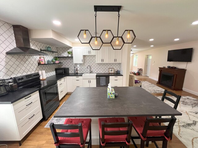20 Occoquan Trl, Albrightsville, PA 18210 - kitchen featuring wall chimney exhaust hood, black appliances, dark countertops, open shelves, and recessed lighting