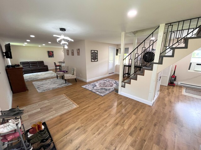 20 Occoquan Trl, Albrightsville, PA 18210 - living area with wood finished floors, baseboards, stairs, recessed lighting, and baseboard heating