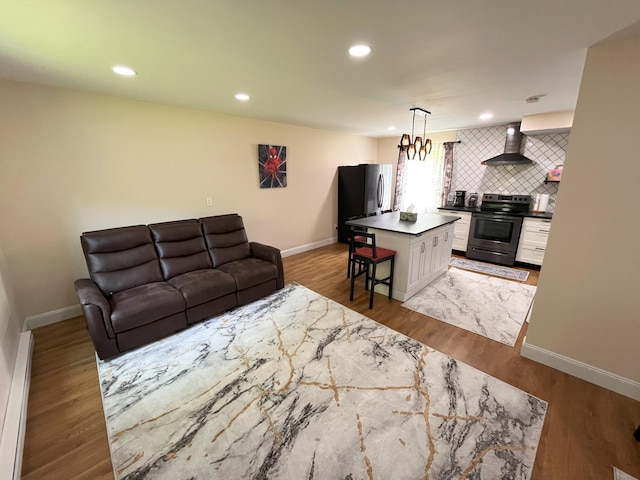 20 Occoquan Trl, Albrightsville, PA 18210 - living room featuring baseboards, recessed lighting, wood finished floors, and a baseboard heating unit