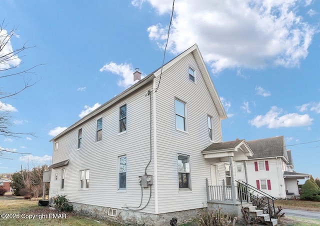 view of front of property with a chimney