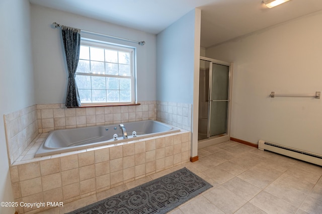 bathroom featuring a shower stall, a bath, baseboards, and tile patterned floors