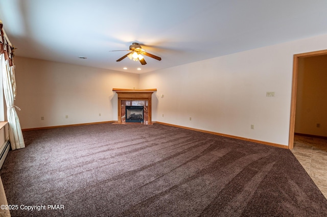 unfurnished living room featuring a fireplace, baseboards, carpet floors, and ceiling fan