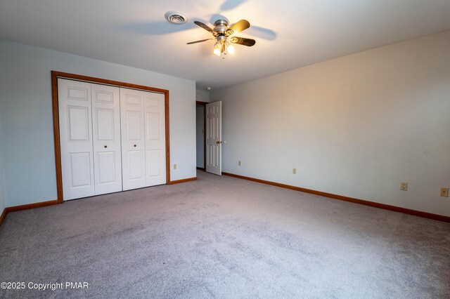 unfurnished bedroom with baseboards, visible vents, and carpet floors