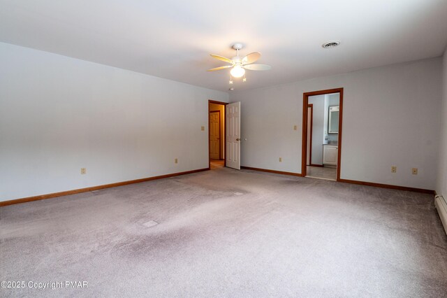 empty room featuring visible vents, light carpet, a ceiling fan, baseboards, and baseboard heating