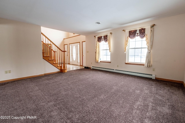 empty room featuring visible vents, stairway, carpet floors, baseboards, and baseboard heating