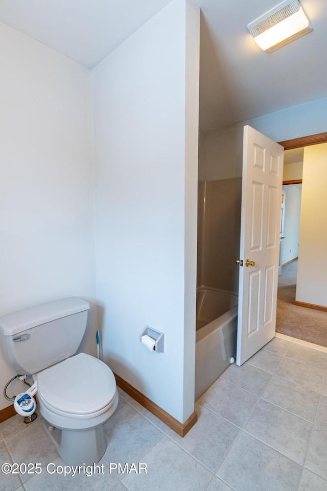 full bathroom with baseboards, toilet, and tile patterned flooring