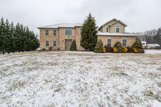 view of front of house with brick siding