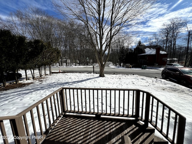 view of snow covered deck