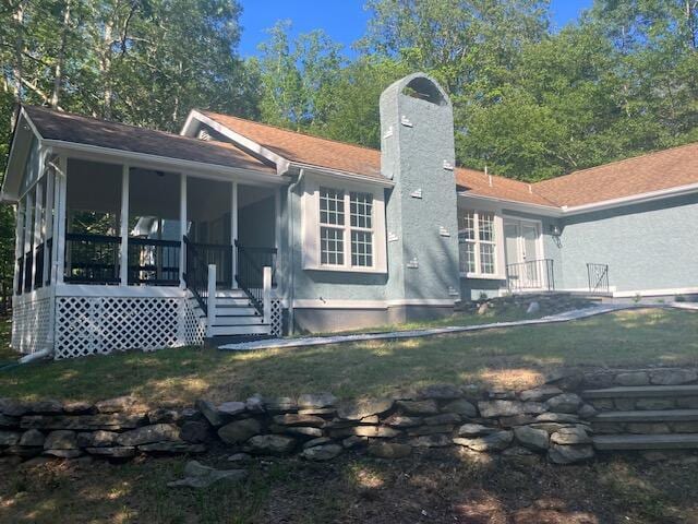 3354 Trafalgar Ave, East Stroudsburg, PA 18302 - back of property featuring a sunroom and a chimney