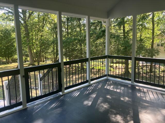 3354 Trafalgar Ave, East Stroudsburg, PA 18302 - unfurnished sunroom with view of wooded area