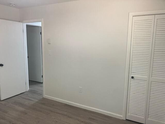3354 Trafalgar Ave, East Stroudsburg, PA 18302 - unfurnished bedroom featuring dark wood finished floors and a closet