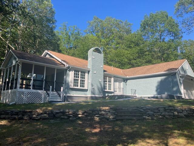 3354 Trafalgar Ave, East Stroudsburg, PA 18302 - rear view of house with a sunroom and a chimney