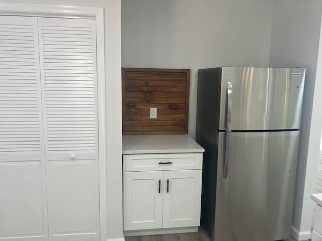 3354 Trafalgar Ave, East Stroudsburg, PA 18302 - kitchen with freestanding refrigerator, light countertops, and white cabinets