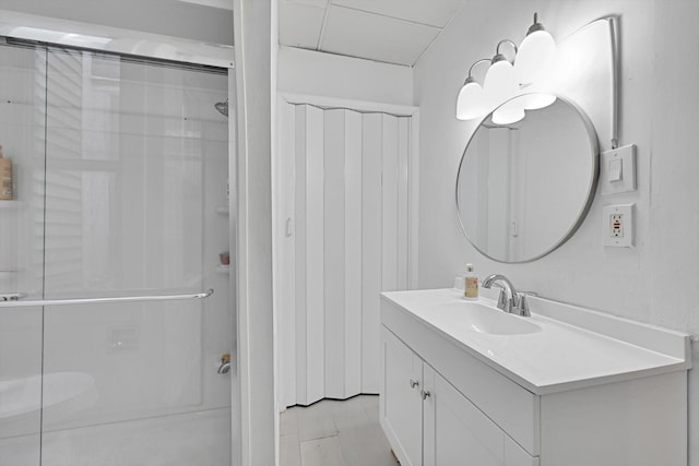bathroom with vanity and a stall shower